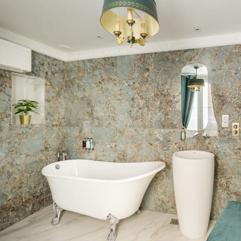 Have a long soak in the freestanding bathtub before an evening out in the City of Love