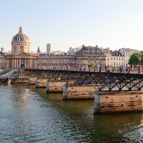 Stroll across the famous Pont des Arts to visit the Louvre