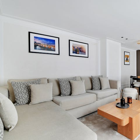 Relax in the stylish living area with a glass of wine after a busy day of exploring