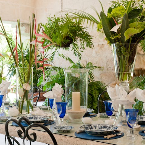 Indulge in a long lunch outside, surrounded by tropical flowers