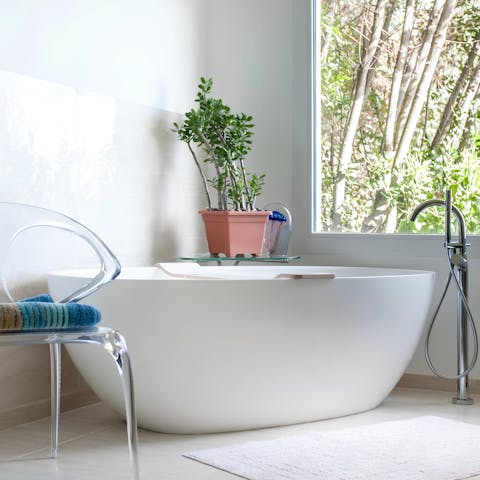 Find a little you-time in one of the home's bath tubs