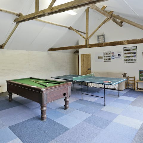 Challenge the family in the barn's games room