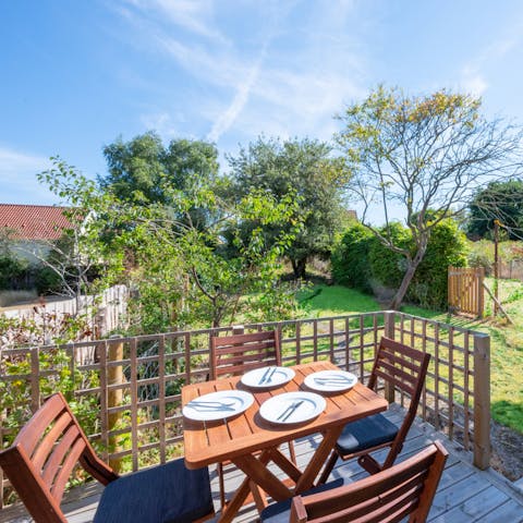 Set the table ready for a light lunch in the sunshine