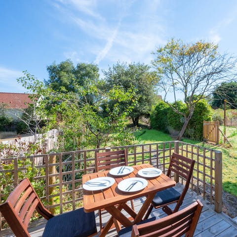 Set the table ready for a light lunch in the sunshine