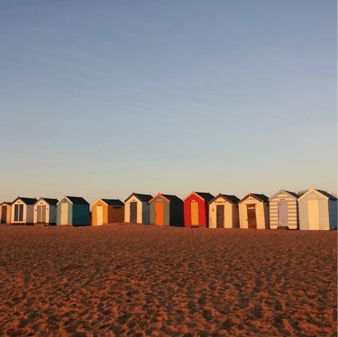 Stroll past the colourful huts on Southwold Beach, a fifteen-minute drive away