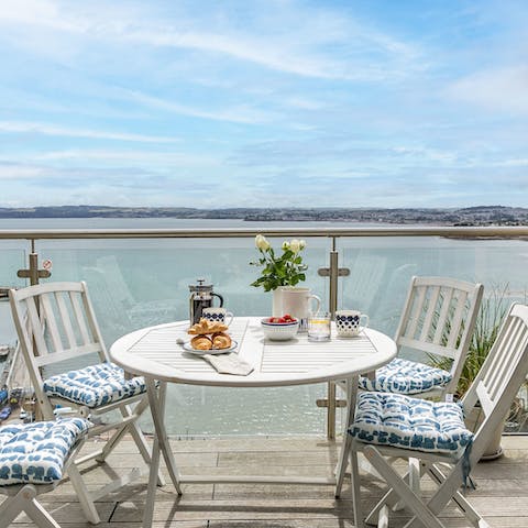 Enjoy a cup of coffee or a glass of wine on the balcony