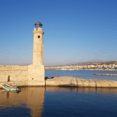 Drive down to Rethymno and visit the iconic lighthouse of the Venetian harbour