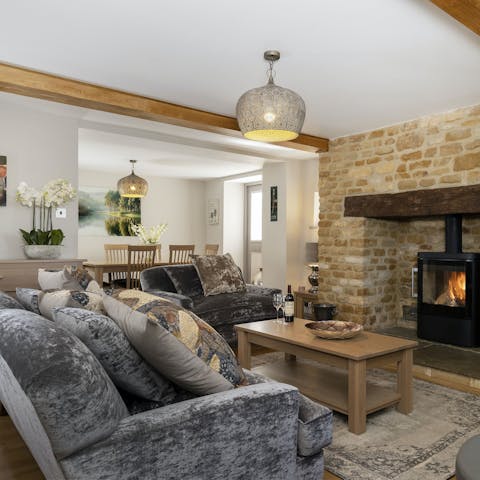 Sink into the sofas for a movie night by the log burner