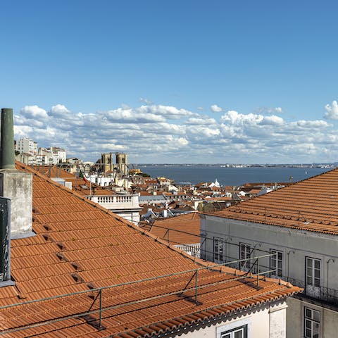 Take in views of the Tagus River and São Jorge Castle from your home's Juliet balconies