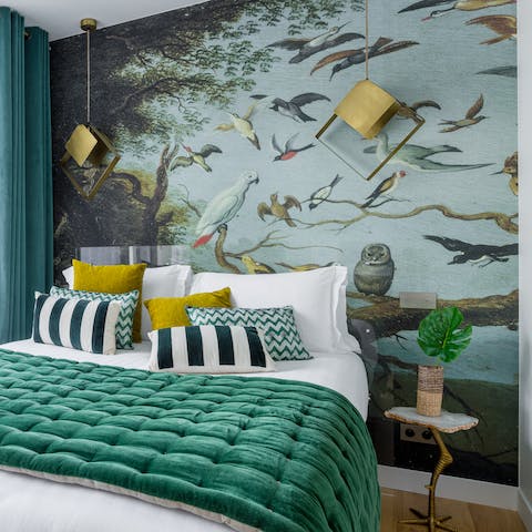 Admire the pretty bird mural in your bedroom
