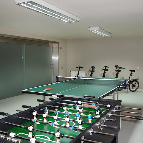 Escape the sun in the games room, playing ping pong or table football
