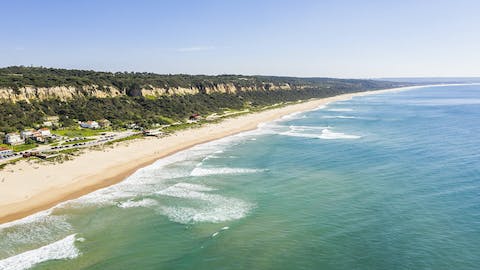 Make the short drive to Fonte da Telha beach, perfect for a cliffside swim