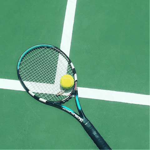 Practice your backhand on the shared tennis court