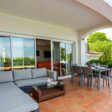 Lounge on the L-shaped sofa or dine alfresco on the covered terrace