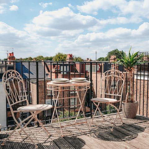 Enjoy an alfresco breakfast on the sunny private roof patio