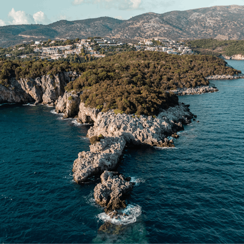 Drive or walk up to Sivota to enjoy authentic restaurants and gardens by the sea