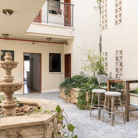 Enjoy an evening aperitif out on the shared courtyard