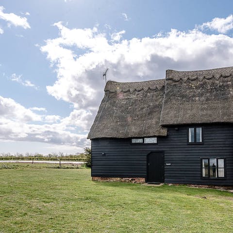 Stay in a characterful, thatched barn