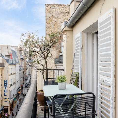 Take in the views over the Odéon district from the balcony