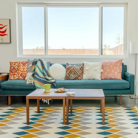 Relax and unwind in the colourful living room