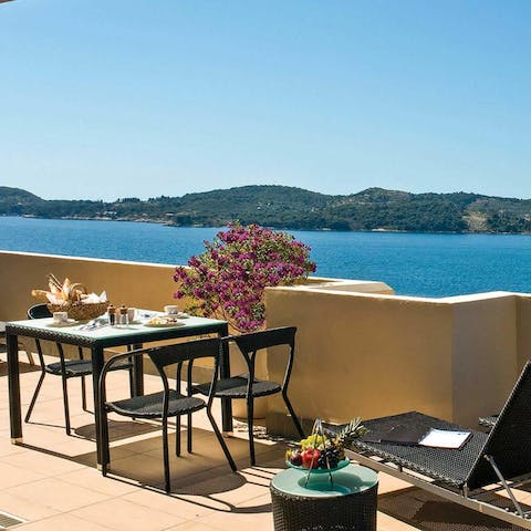 Sit out on your own private balcony overlooking the sea