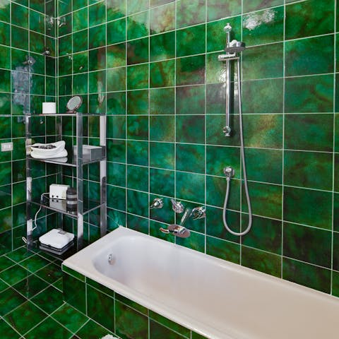 Freshen up in this funky green bathroom after a day in the hot sun