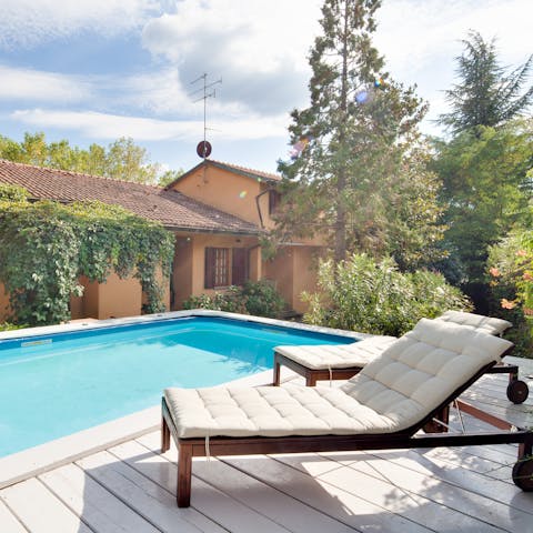 Relax in the sun loungers with a glass of wine after a few lengths in the pool