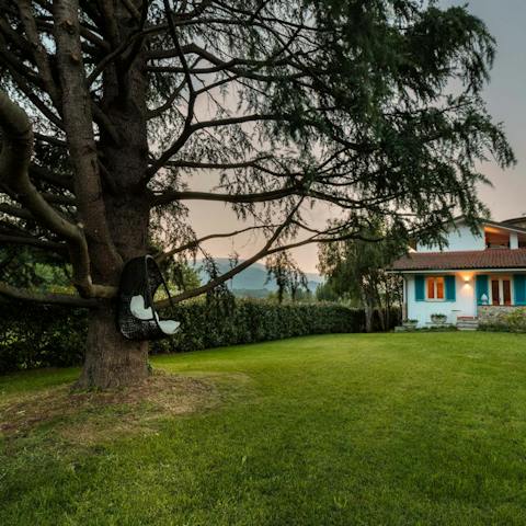 Curl up under a tree with a good book as the kids play on the lawn