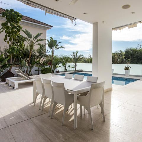 Dine alfresco beside your private pool