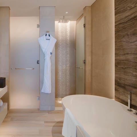 Close your eyes and sink back into steamy water in the elegant bathtub