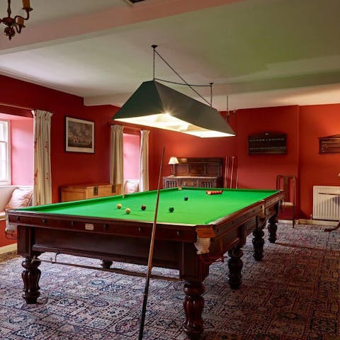 Head to the games room for some rounds on the full-sized snooker table