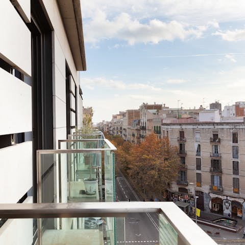 Take in views of your Eixample neighbourhood from the living room's balcony