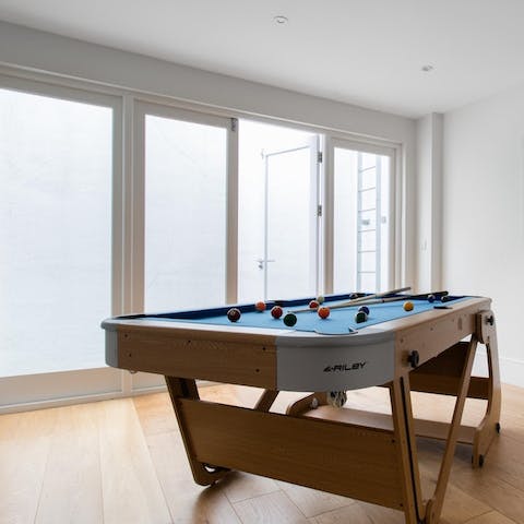 Play a few frames of pool in the games room