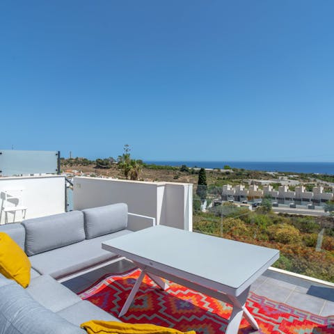 Admire the sea view from the rooftop terrace