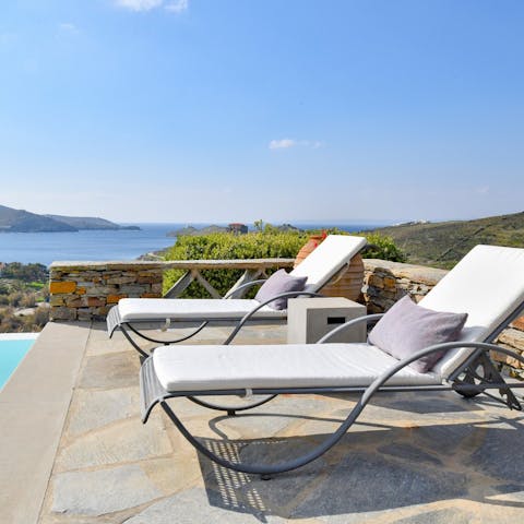 Sprawl out on the lounge chairs and admire the Aegean Sea views