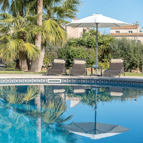 Soak up the Spanish sunshine from a poolside lounger while enjoying your leafy surroundings