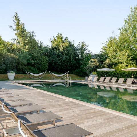 Lounge by beside the outdoor pool in the warmer months, catching some rays and reading your book