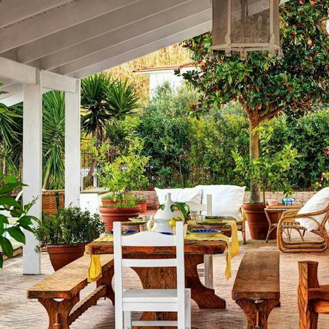 Gather at the rustic outdoor dining areas for alfresco meals