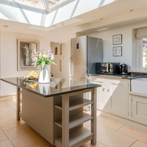 Cook in the bright, modern kitchen with high-spec appliances