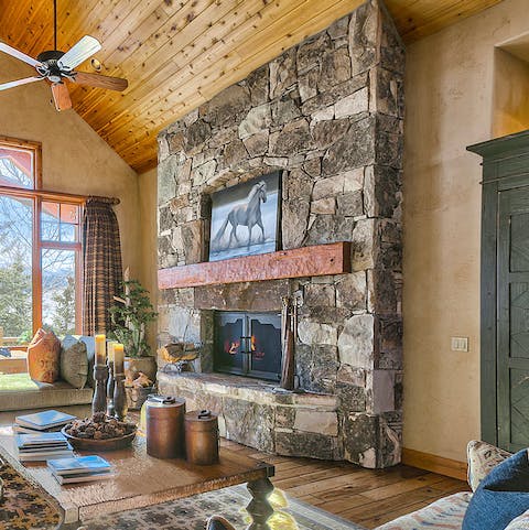 Get a fire going in the mountain-chic grate in the living room
