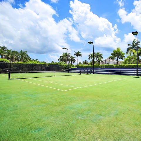 Challenge a friend to a tennis match on the championship courts