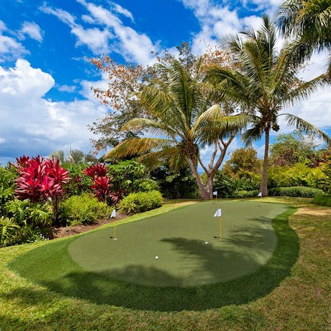 Practice your putting skills at home before heading to one of the world-class golf courses nearby