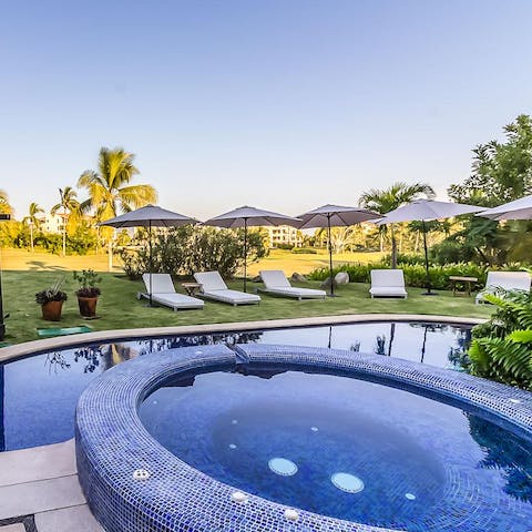 Relax in the hot tub after a day spent swimming and sunbathing