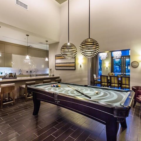 Enjoy a pool tournament in the communal games room