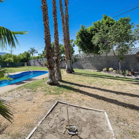 Play a game of horseshoes beneath the shade of the palms