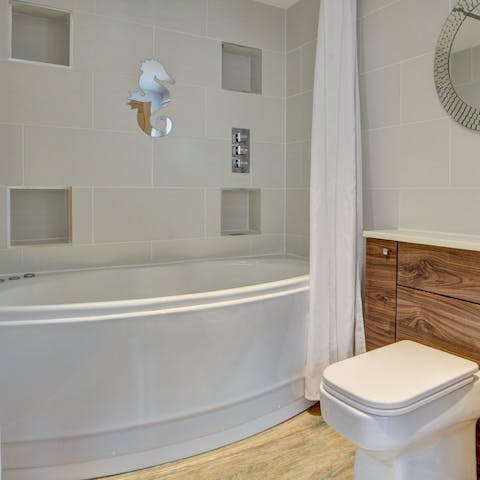 Sink back into the Jacuzzi bath in the master en-suite