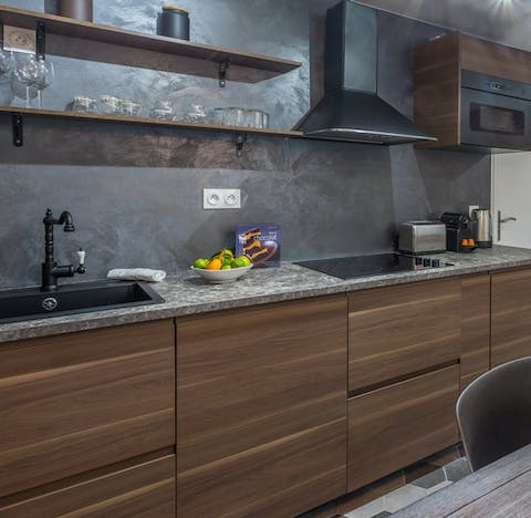 Cook up a home-made dinner paired with some local French wine in the sleek kitchen 