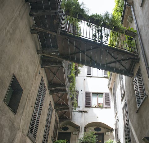 Stroll through the classically Milanese courtyard to start your day