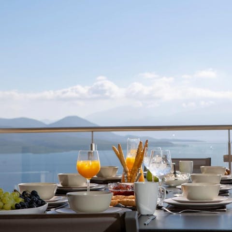 Enjoy breakfast on the balcony overlooking the blue sea