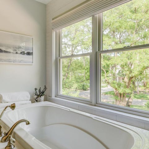 Enjoy a soak in the tub with a view of the pretty garden